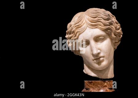 Close-up on broken head of ancient roman statue of sad woman Stock Photo