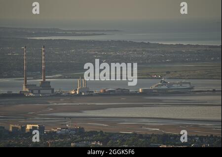 Dublin, Ireland-June 11, 2021: Beautiful closeup aerial view of Poolbeg CCGT chimneys, Pigeon House Power Station and Irish Ferries seen from Ticknock