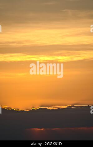 Beautiful orange sunset cloudy skies over hills in Dublin Mountains seen from Fairy Castle, Two Rock Mountain, Co. Dublin, Ireland. Sunset gradients Stock Photo