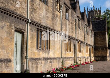 Campden Almshouses. Row of historic stone almshouses in Church Street, close to St James' Church in the Cotswold Town of Chipping Campden, UK. Stock Photo