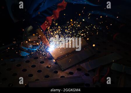 Close-up, metal structure welding. Semi-automatic manual welding. MIG welding. Stock Photo