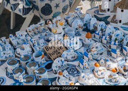 Ana Mera, Greece - September 24, 2019: Souvenirs on sale at the market stalls in Ana Mera, a town on Mykonos Island famous for its monasteries. Stock Photo