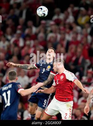 Scotland's Lyndon Dykes and Denmark's Joachim Andersen battle for the ball during the 2022 FIFA World Cup Qualifying match at the Parken Stadium, Copenhagen. Picture date: Wednesday September 1, 2021. Stock Photo