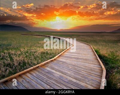 Pathway and sunset in Badlands National Park, South Dakota. Stock Photo