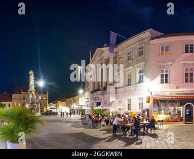 Baden near Vienna, square Hauptplatz, Plague Column, Town Hall, open air restaurant in Wienerwald (Vienna Woods), Niederösterreich / Lower Austria, Austria Stock Photo