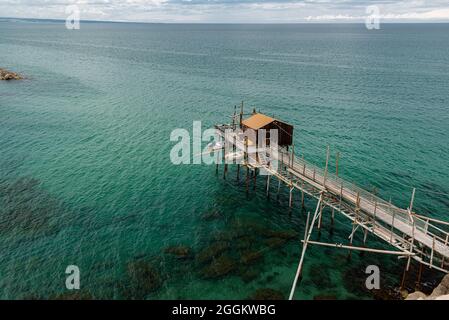 At the foot of the ancient village of Termoli, the Promenade of the Trabucchi winds its way, a portion of the coast from which you have access to the Stock Photo