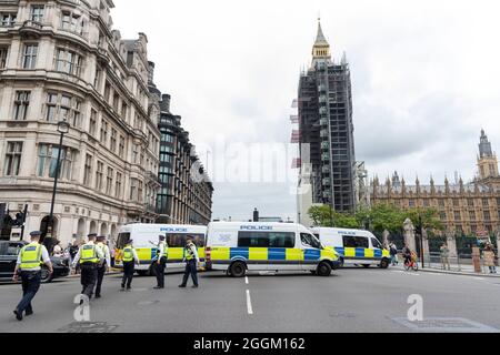 London, UK. 01st Sep, 2021. Police officers block protesters from getting onto Westminster bridge after they have blocked the Tower and London Bridge in the past few days.Extinction Rebellion activists staged a “Greenwash” protest as part of their two-week Impossible Rebellion against the Government's shameful Greenwashing, in relation to their immediate demand of ending fossil fuel funding on the 10th day of the Impossible Rebellion protests. Credit: SOPA Images Limited/Alamy Live News Stock Photo