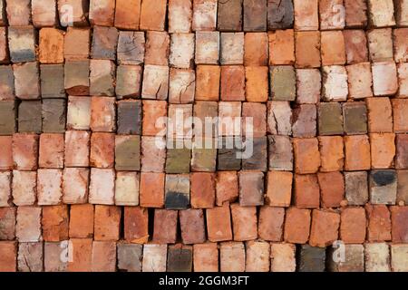 Texture of rows and columns of fired bricks, made by hand in a supply store in Sorong, West Papua, Indonesia Stock Photo