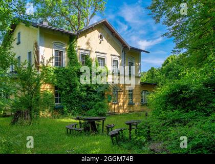 Lost Place, overgrown beer garden with moss-covered seating areas, Gasthof Obermuehltal, Bavaria, Germany, Europe Stock Photo