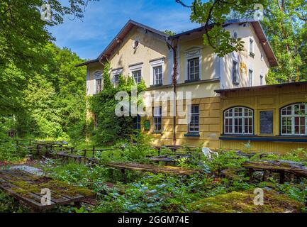 Lost Place, overgrown beer garden with moss-covered seating areas, Gasthof Obermuehltal, Bavaria, Germany, Europe Stock Photo