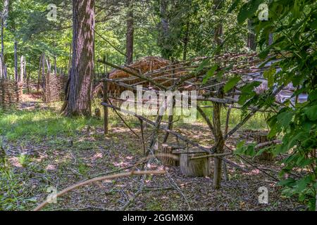 A wooden lean to in the recreated Native American village in the Monacan Living History Exhibit at Natural Bridge State Park in Virginia. Stock Photo