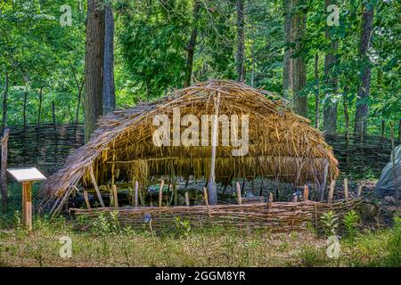 A wooden lean to in the recreated Native American village in the Monacan Living History Exhibit at Natural Bridge State Park in Virginia. Stock Photo