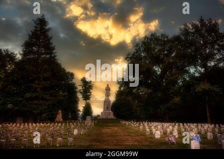 Looking toward the Private Soldier Monument at dusk in the Antietam National Cemetery in Sharpesburg, Maryland. Stock Photo