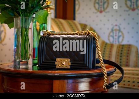 Venice, Italy Jun8 2019: black leather Chanel bag Chanel boy 8 inch.  Classic luxury style gold chain with black leather Luxury handbag. Shopping  conc Stock Photo - Alamy