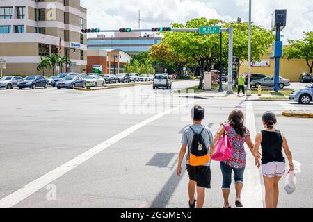Miami Florida,Coral Way 27th Avenue,crossing large street intersection traffic,Hispanic woman female male boy girl mother son daughter children Stock Photo