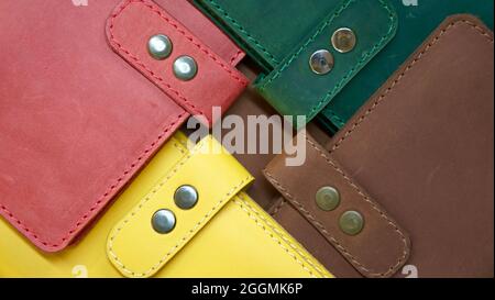 Color samples of texture of leather products from genuine animal skin. Yellow, red, green, brown Stock Photo