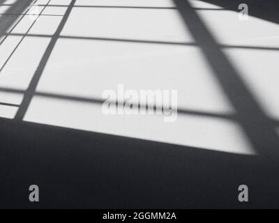 Black shadows on the floor, abstract lines, shadow as background Stock Photo