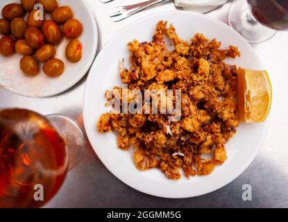 Spanish seafood dish battered fried baby squid Stock Photo