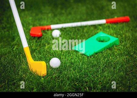 toy golf play set on green grass. garden games Stock Photo