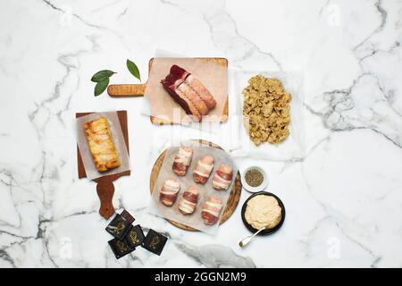 Various cuts of meat on a marble background Stock Photo