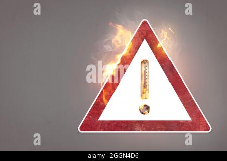 Warning sign with a burning thermometer - global warming concept Stock Photo
