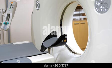 A computer tomography scanner and a contrast media injector. A radio opaque media is used for diagnostic examination in certain circumstances. Stock Photo