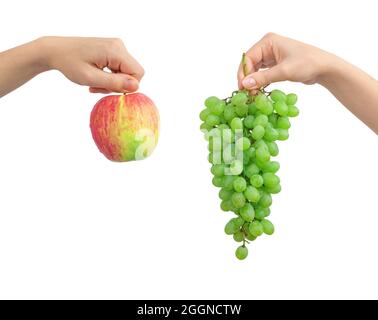 Red apple and green grape in hands, mix fruits isolated on a white background Stock Photo