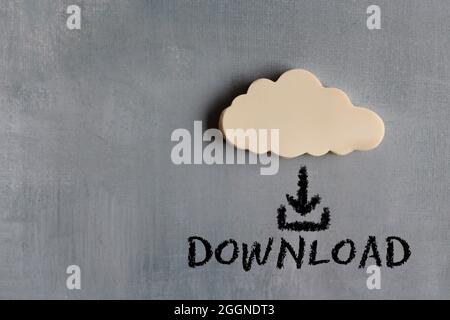 Cloud computing, network concept. White cloud and text DOWNLOAD with downward arrow icon Stock Photo