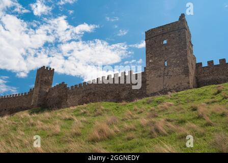 Spring landscape with wall and towers of an ancient Genoese fortress in Sudak, Crimea, Ukraine Stock Photo