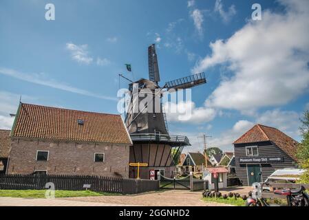 Oudeschild, the Netherlands. August 13 2021. De molen in het dorpje Oudeschild op het eiland Texel. High quality photo Stock Photo