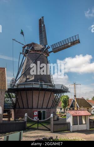 Oudeschild, the Netherlands. August 13 2021. De molen in het dorpje Oudeschild op het eiland Texel. High quality photo Stock Photo