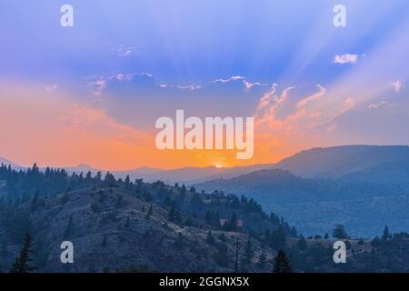 Dramatic Sunset behind the mountains of Yellowstone National Park, Montana Stock Photo
