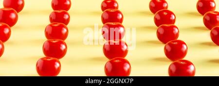 Pattern of red tomatoes on a light yellow background Stock Photo