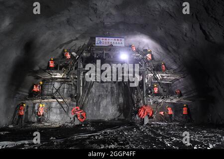 Du'an. 1st Sep, 2021. Workers prepare the drill-through of a railway tunnel in Du'an Yao Autonomous County, south China's Guangxi Zhuang Autonomous Region. Sept. 1, 2021. A 15.2-km tunnel on the high-speed railway linking Nanning of south China's Guangxi Zhuang Autonomous Region and Guiyang of southwest China's Guizhou Province was drilled through on Thursday. Credit: Lu Boan/Xinhua/Alamy Live News Stock Photo