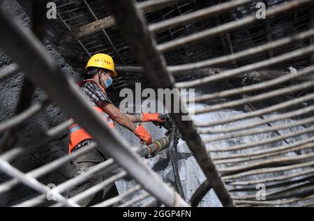 Du'an. 1st Sep, 2021. A worker prepares the drill-through of a railway tunnel in Du'an Yao Autonomous County, south China's Guangxi Zhuang Autonomous Region. Sept. 1, 2021. A 15.2-km tunnel on the high-speed railway linking Nanning of south China's Guangxi Zhuang Autonomous Region and Guiyang of southwest China's Guizhou Province was drilled through on Thursday. Credit: Lu Boan/Xinhua/Alamy Live News Stock Photo