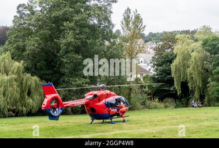 Devon Air Ambulance responding to an emergency call, and landing in The Byes, Sidmouth Stock Photo