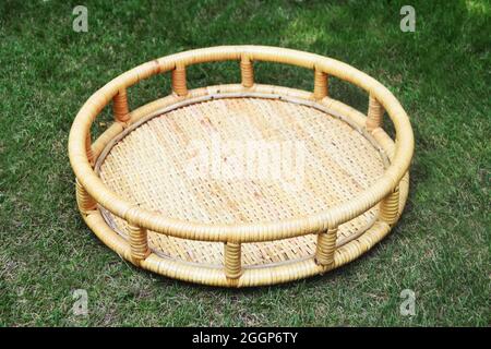 rattan cane gift basket with outdoor background selective soft focus Stock Photo