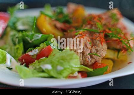 Pulled pork with potatoes and herbs. Stock Photo