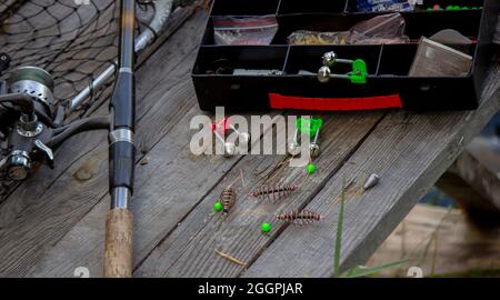Fishing tackle on the river bank, bait rod, spinning rod, fish. Nature.  Selective focus Stock Photo - Alamy