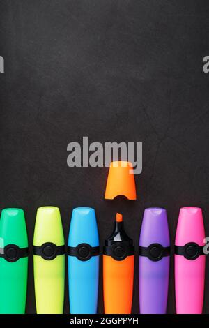 Markers of different colors on a black background. free space Stock Photo