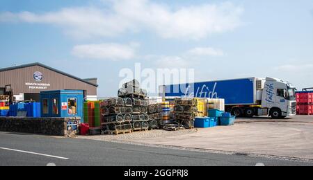 Newlyn, Cornwall, England, UK. 2021. Newlyn Harbour fish market the largest fishing port in England, UK. Lorry on site to transport fish. Stock Photo