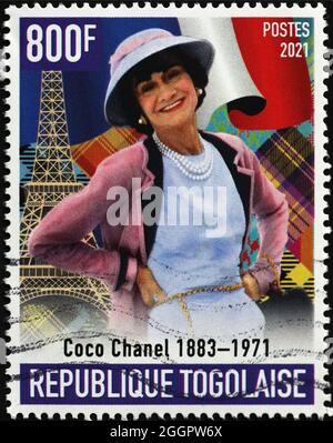 Gabriel Coco Chanel smiling on postage stamp Stock Photo