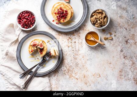 Beautifully served table for breakfast with many delicacies, cheeses, salami, pastries, orange juice, tea and coffee. Stock Photo