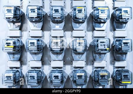 Electricity meters on panel in an apartment building. Samui , Tailand - 02.06.2020 Stock Photo