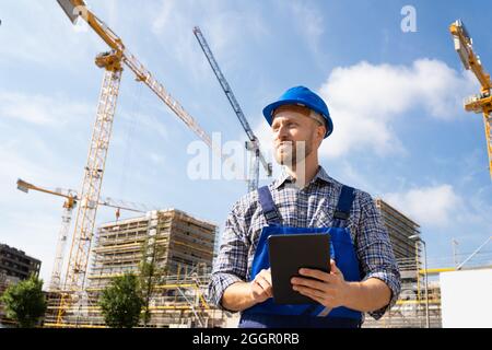 Construction Worker Or Engineer At Site Inspecting Stock Photo
