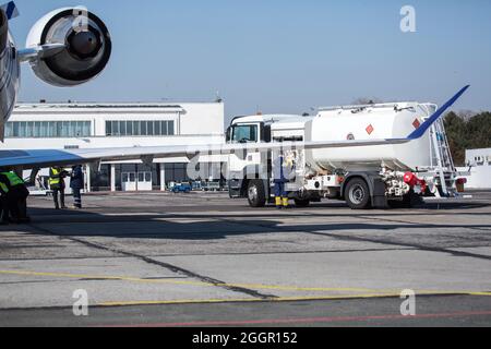 Refueling the plane at the airport. Gas tank hatch. Fuel tank. Copy space  Stock Photo - Alamy