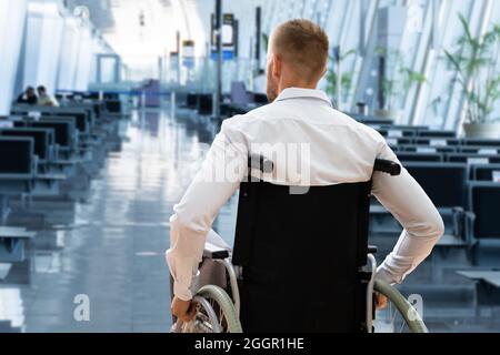 Disabled Adult People Travel In Wheelchair At Airport Stock Photo