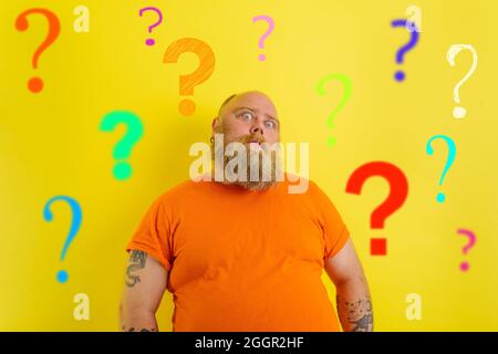 Fat doubter man has doubts about covid-19 vaccine Stock Photo