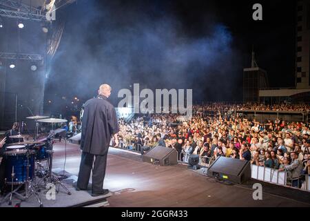 Odessa, Ukraine July 11, 2019: Many spectators at concert. crowd of visitors to concert has fun and shoots what is happening on smartphones. Fans at c Stock Photo