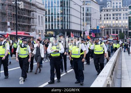 London, UK, 02 Sep 2021. Day 11.  Outside the Bank of England -  Extinction Rebellion, under Impossible Rebellion name,  continues its 11th day protest in City of London. marching and drumming their way from Bank of England to London bridge south side, evening rush hour traffic stands still. Credit:  Credit: Xiu Bao/Alamy Live News Stock Photo